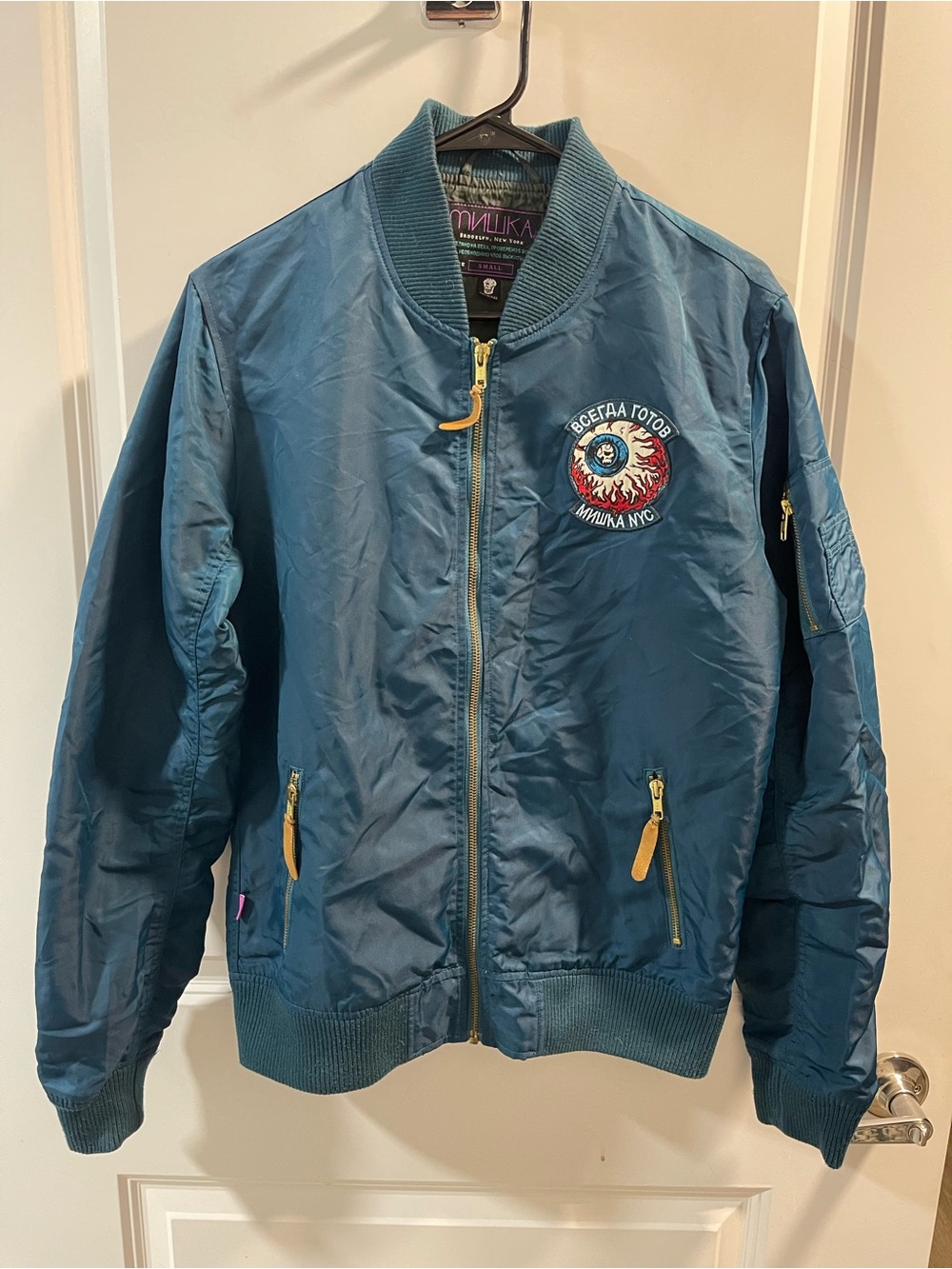 Mnwka Teal Satin Bomber Jacket with Embroidered Eyeball Patch
